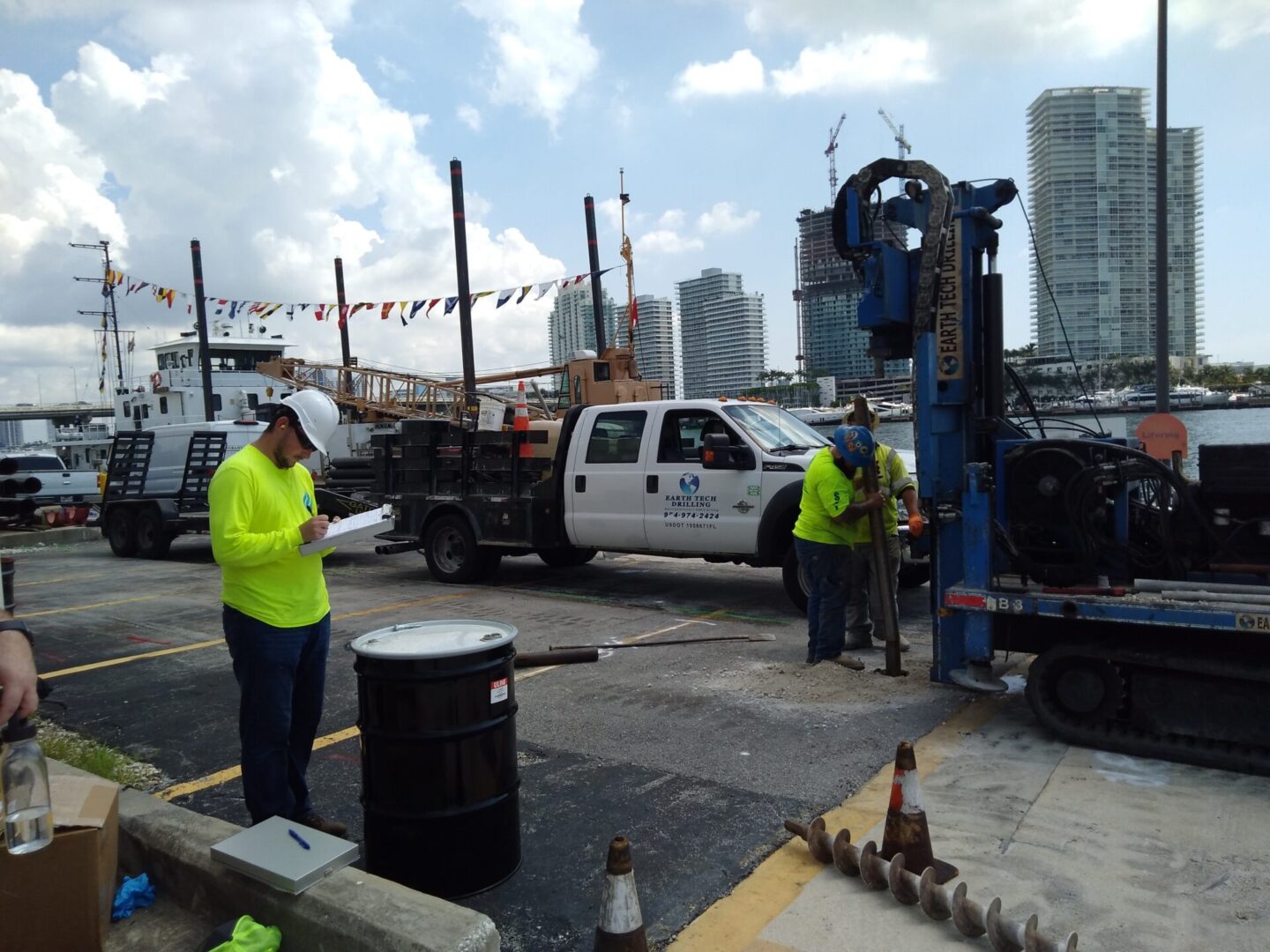 Construction worker inspecting drilling rig.