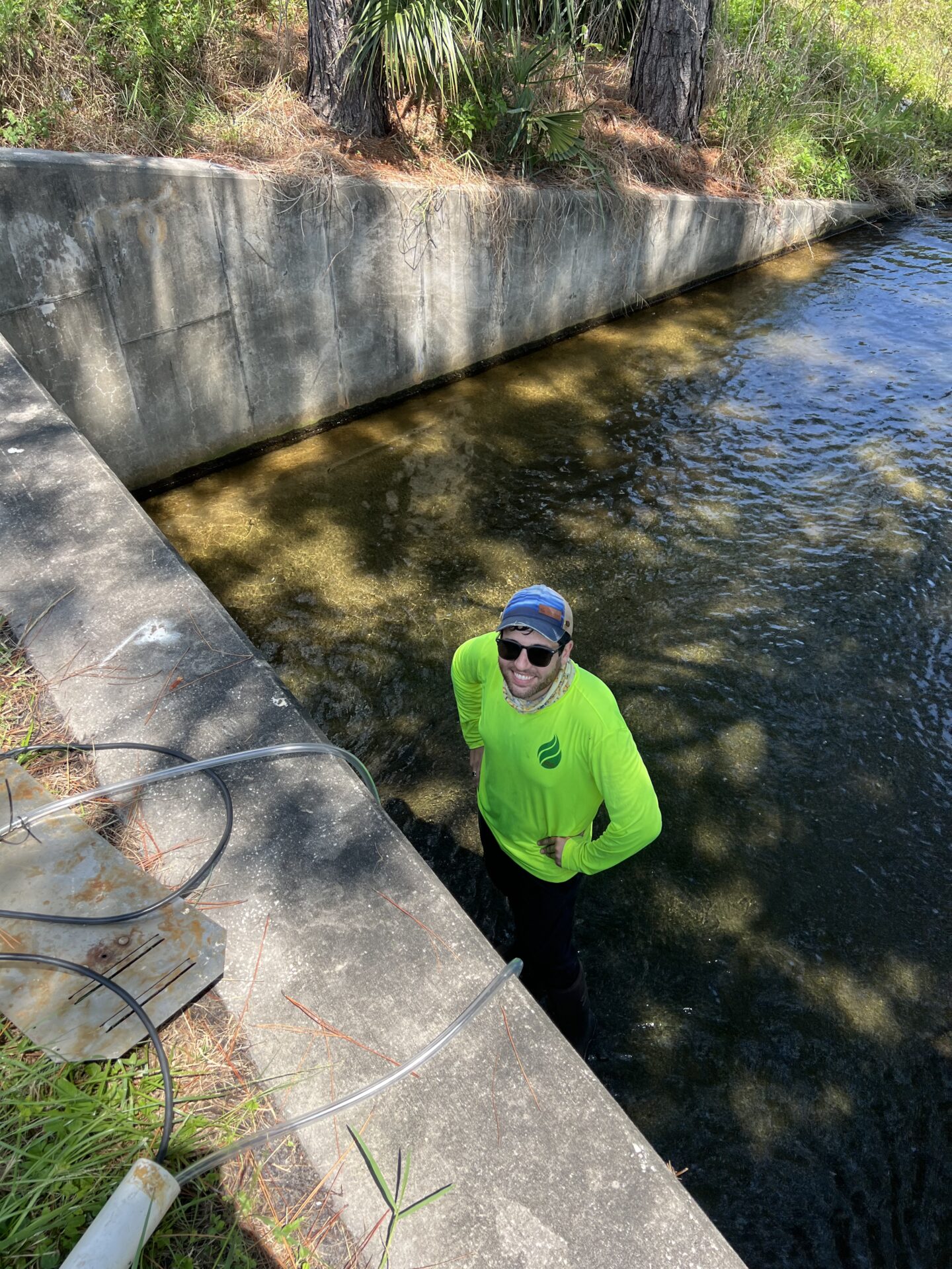 Person standing in a shallow stream.