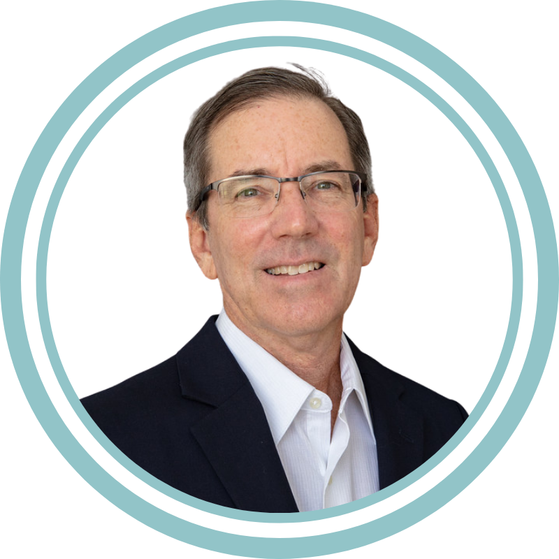 Man in suit with abstract circular design.